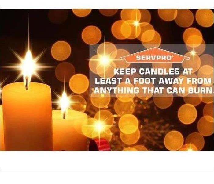 holiday candles aglow with SERVPRO logo graphic
